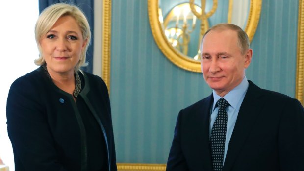 French far-right presidential candidate Marine Le Pen shakes hands with Russian President Vladimir Putin  in the Kremlin, Moscow, last month.
