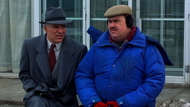 The stress of business travel gets the better of Steve Martin's character, shown with co-star John Candy, in Planes, Trains and Automobiles.