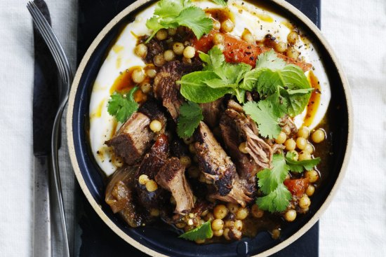 Serve this slow-roasted  lamb with greens, thick yoghurt and bread. 