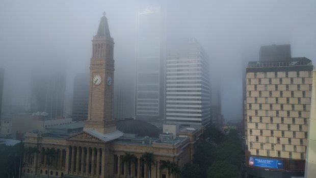 Thick fog formed over Brisbane early on Tuesday, delaying public transport.