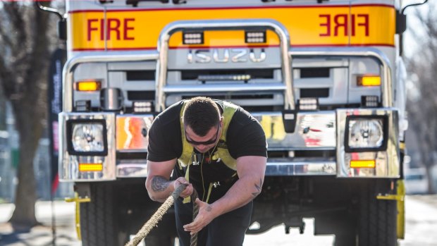 Canberra Big Boys Toys Expo 2016 Media Launch- Canberra strongman Andrew Fraser pulls a fire-truck under his own steam.
