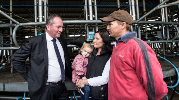Barnaby Joyce talks with dairy farmer Ashley Galt and his wife Lucy Galt in May.