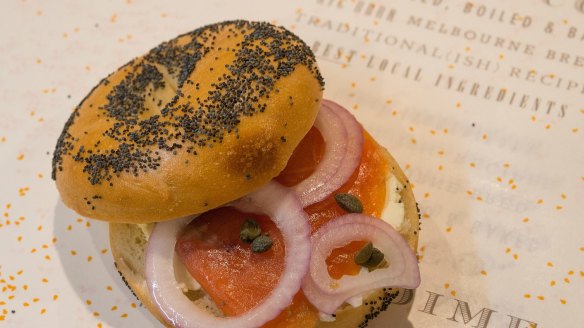Smoked salmon, red onion, cream cheese and capers on a poppy-seed bagel at 5 & Dime.