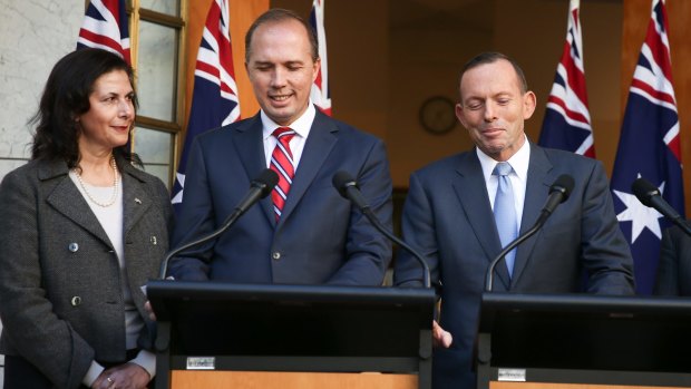 Happier times: Senator Concetta Fierravanti-Wells, Immigration Minister Peter Dutton and then prime minister Tony Abbott during a press conference at Parliament House in Canberra on May 26, 2015. 