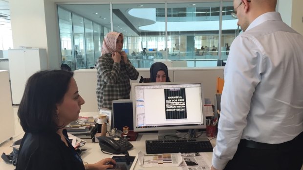 Editors at <i>Today's Zaman</i> newspaper in Turkey prepare for publication just before a police raid on the night of March 4. Editor-in-chief Sevgi Akarcesme is at left.