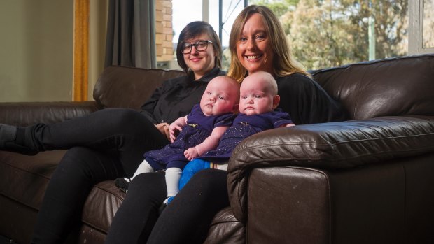 Caitlin Benson, left, Amanda Taylor and 4 month old twins Lucy Taylor and Lili Taylor. 