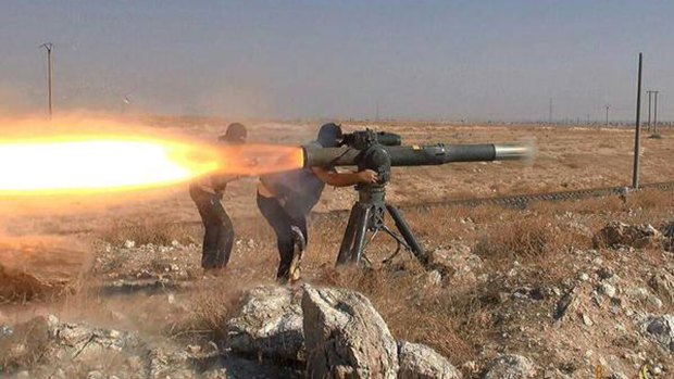 Islamic State militants fire an anti-tank missile in Hassakeh, northeast Syria. 