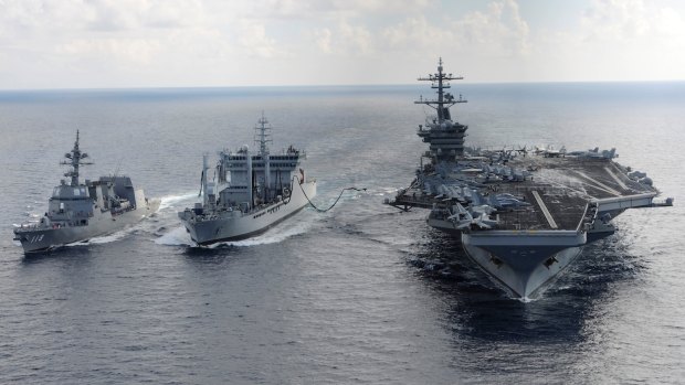 US carrier USS Theodore Roosevelt and Japanese Akizuki-class destroyer JS Fuyuzuki alongside the Indian Deepak-class fleet tanker INS Shakti during an exercise in 2015.