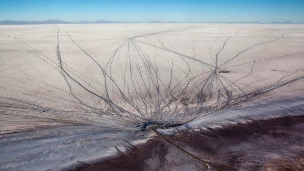 Vehicle tracks scar the Salar de Uyuni. 