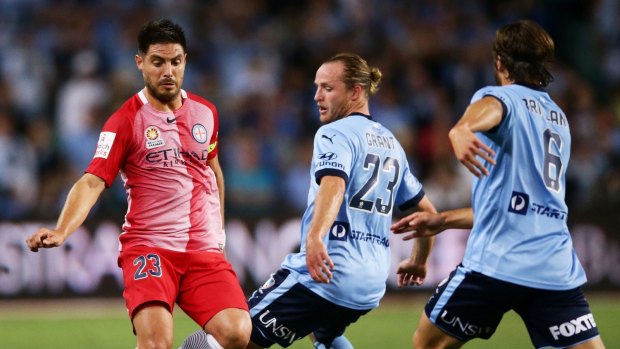 Lacking sparkle: Melbourne City's Bruno Fornaroli feels the pressure from his Sydney FC opponents in the 3-0 loss on Saturday. 