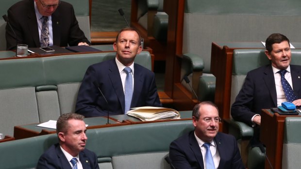 Former prime minister Tony Abbott and former defence minister Kevin Andrews take their seats on the backbench for question time.