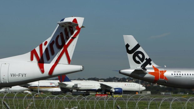 Dozens of domestic flights were grounded at Sydney Airport on Thursday due to high winds. 