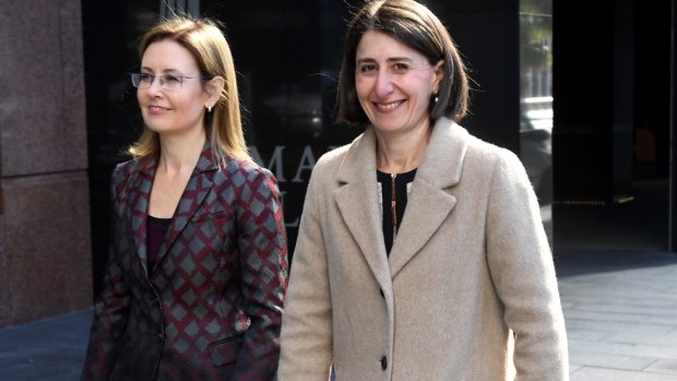NSW premier Gladys Berejiklian and Local Government minister Gabrielle Upton arrive at the press conference last week where they announced the government's backflip on council mergers. 