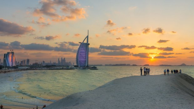 Burj Al Arab and Jumeirah Beach Hotel at sunset. 