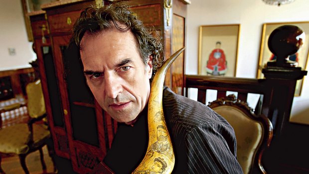 Tom Thompson, a collector of Ned Kelly memorabilia, in 2006 with a scrimshaw horns carved with Kelly gang imagery. 