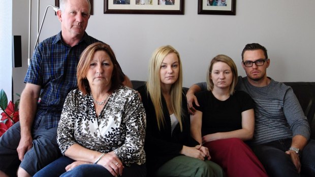 Distraught: the family of murdered man Greg Gibbons.