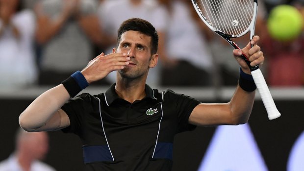 Centre of affection: Novak Djokovic soaks up the applause after beating Albert Ramos-Vinolas of Spain.