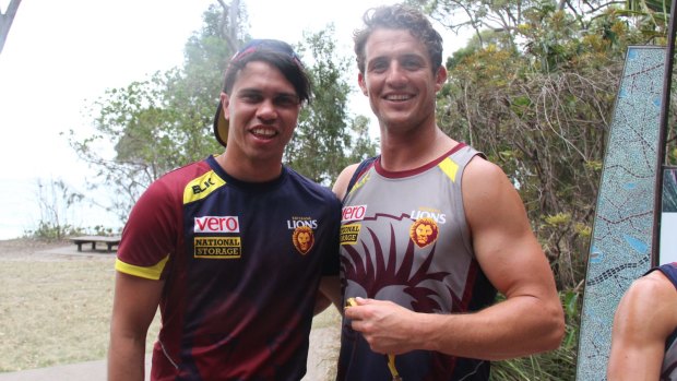 On location: Former Cat Allen Christensen (left) and new Lions teammate Matt Maguire at Brisbane's training camp
at Noosa.