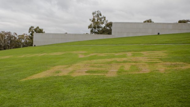 Word burnt into the lawns of Parliament House in July.