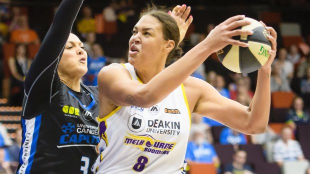 Capitals forward Mistie Bass tries to defend against Boomers centre Liz Cambage on Sunday.