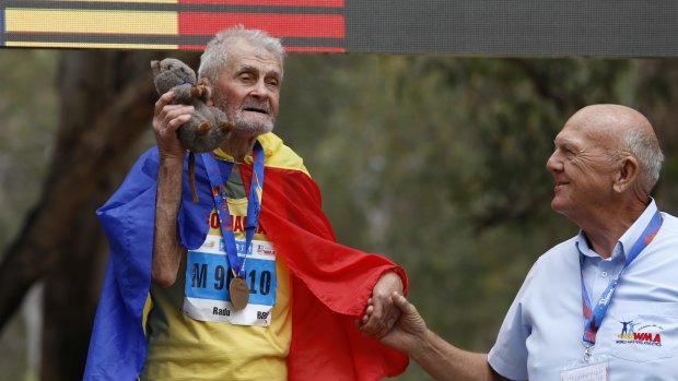 Dumitru Rado, 92 from Romania, celebrates his gold in the Mens 90+ cross country. 
