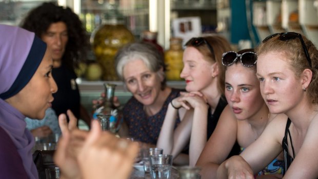 Cesca Falcini, 14 (with black and white sunglasses) and friend Alycia Eicke, 15, at the Moroccan Deli-cacy cafe in Brunswick taking part in Speed Date a Muslim, asking Muslim women about their faith and culture. 