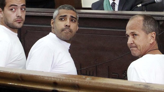 Al-Jazeera journalists Baher Mohamed, Mohammed Fahmy, and Peter Greste appear in court in March, 2014.