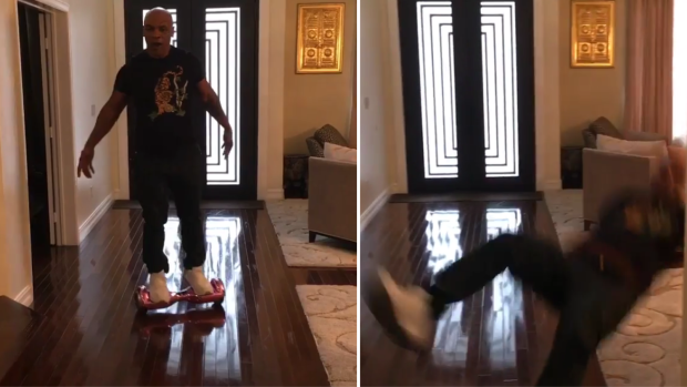 Mike Tyson eats it after driving his daughter's hoverboard too close to the carpet.