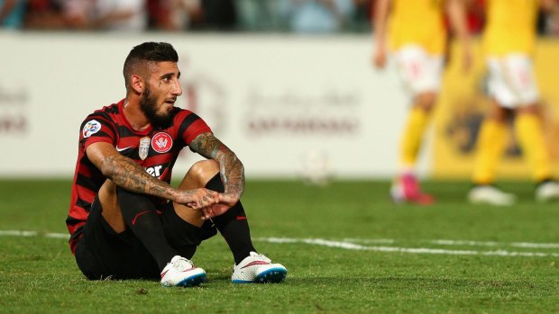 Surface tension: Kerem Bulut of the Wanderers sits on the much-criticised Pirtek Stadium after Wednesday's ACL match against Guangzhou Evergrande.
