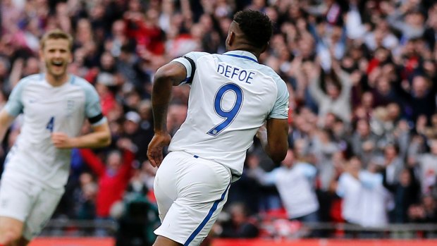 Happy return: Jermain Defoe marked his return to the England setup with a goal.