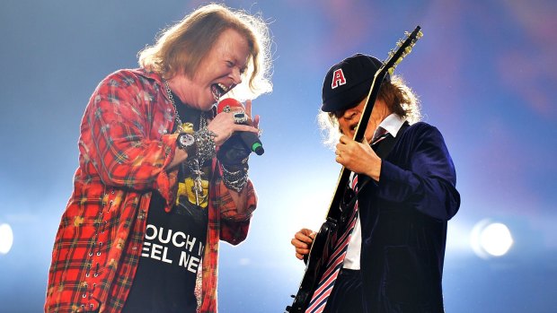 Singer Axl Rose, left and Angus Young of the band AC/DC perform at the Olympic Stadium in London, Saturday, June 4, 2016.