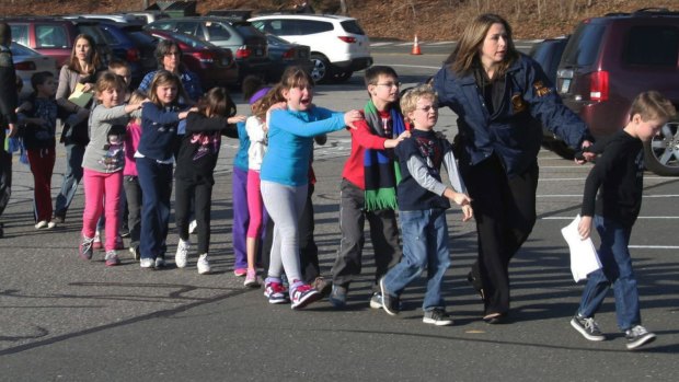 Police lead children from the Sandy Hook Elementary School in Newtown, Connecticut, where 26 people were killed in December 2012. 