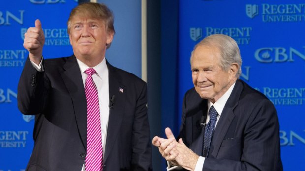 Donald Trump with Reverend Pat Robertson – getting support from evangelicals.