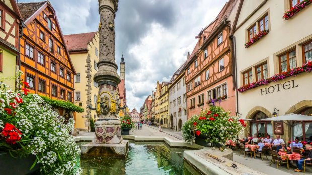 The historic town of Rothenburg ob der Tauber with fountain, Franconia, Bavaria.
