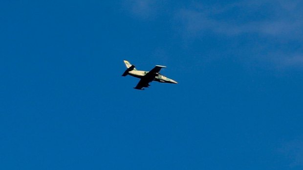 A Syrian war plane flying over the village of Jibreen, south of Aleppo, on Saturday.