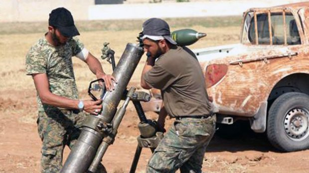 Rebel fighters from Ahrar al-Sham prepare an attack on Islamic State in Aleppo.