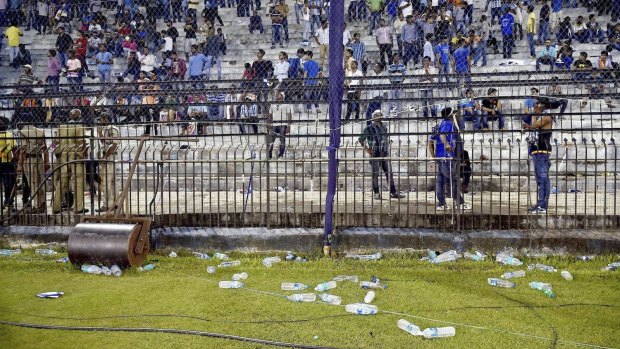 Trouble: Water bottles thrown by spectators lie on the ground during the T20 match between India and South Africa.
