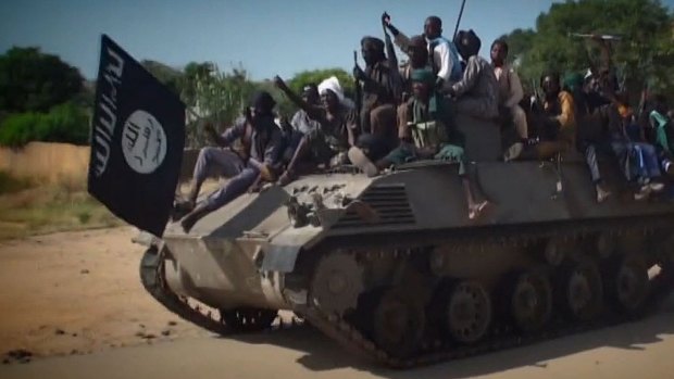 Boko Haram fighters parading on an armoured personnel carrier. Boko Haram has seized the town of Chibok in Borno state.