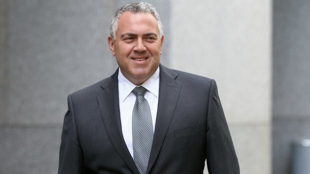 Then treasurer Joe Hockey addresses the media during a doorstop interview regarding multinational tax, at Parliament House in Canberra in December 2014.