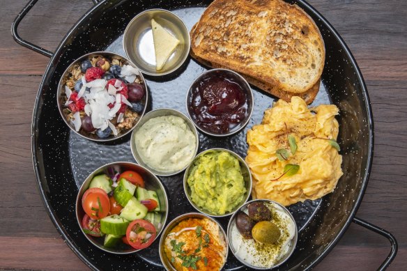 Israeli breakfast with scrambled eggs. 