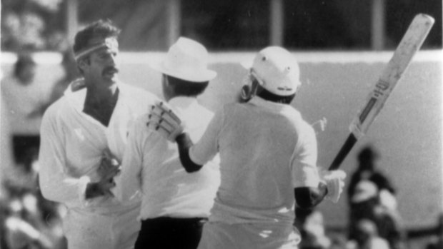 Not happy, Javed: Javed Miandad, right, attempts to get after the Pakistan team following their loss to India. 