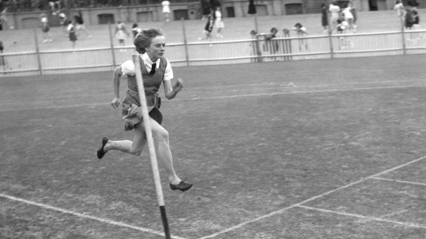 Child ctar: Betty Cuthbert, then 14, from Macarthur Girls High School, tries out the track at a schools athletics carnival in Sydney on July 16, 1952.