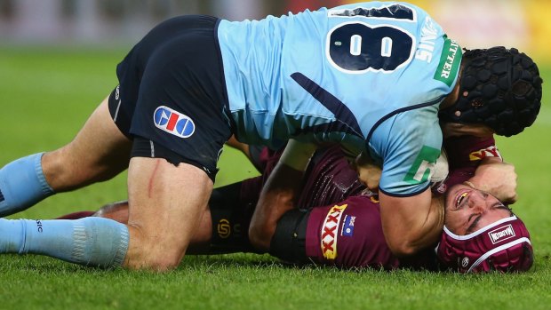 Michael Ennis roughs up Johnathan Thurston during Origin III.