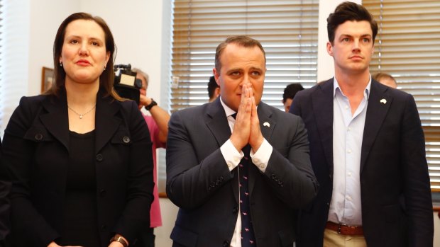 Revenue and Financial Services Minister Kelly O'Dwyer, Liberal MP Tim Wilson and his partner Ryan Bolger wait for the result.