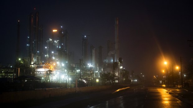 A Valero oil refinery's flare continues to burn as Hurricane Harvey made landfall in Corpus Christi, Texas, on Friday.