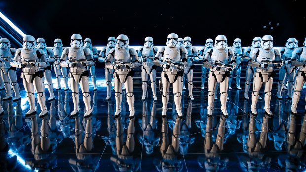 Inside a hangar bay of a Star Destroyer, 50 Stormtroopers greet riders on Rise of the Resistance