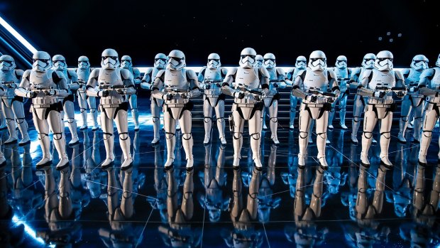 Inside a hangar bay of a Star Destroyer, 50 Stormtroopers greet riders on Rise of the Resistance
