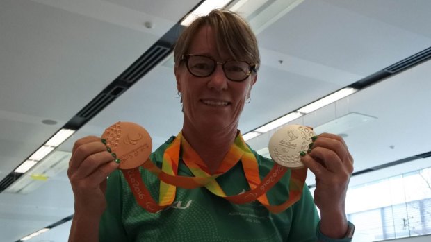 Canberra Paralympian Sue Powell returned home decked out in gold, silver and bronze.