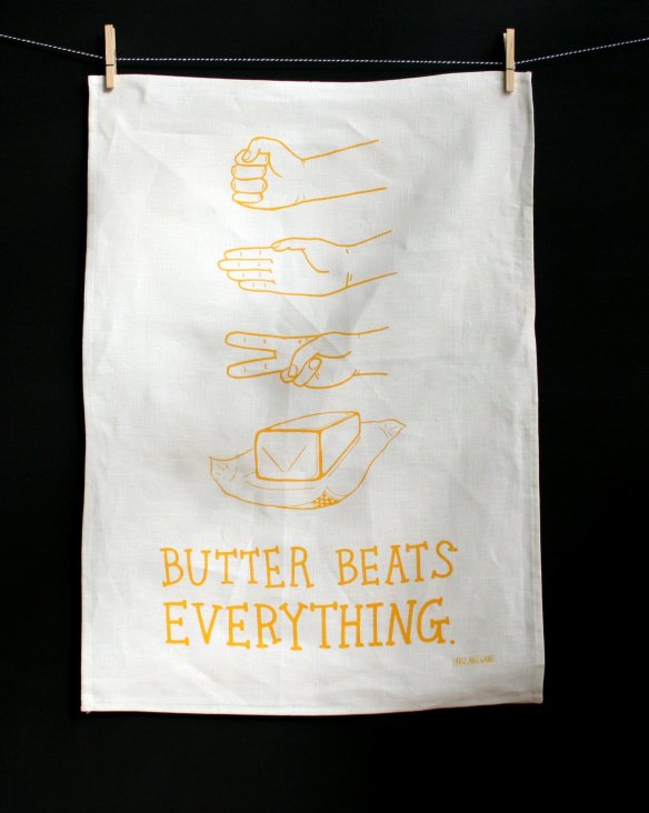 "Butter Beats Everything" tea towel by Able and Game, $22, from Etsy, <a href="https://www.etsy.com/au/listing/155266239/tea-towel-butter-beats-everything" target="_blank">etsy.com</a>.