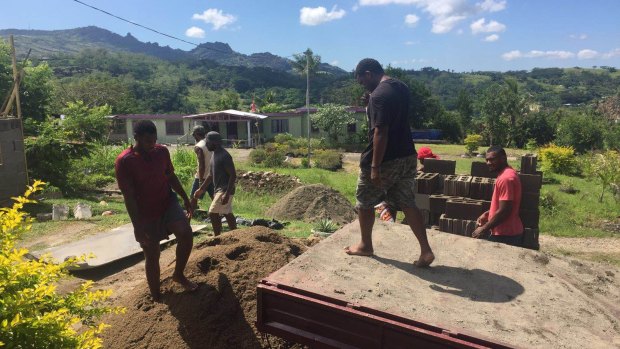 Helping out: Samu Kerevi helps rebuild his parents' house damaged in Fiji cyclone.